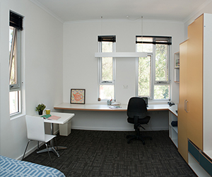 Image of the desk and wardrobe space within the standard premium rooms
