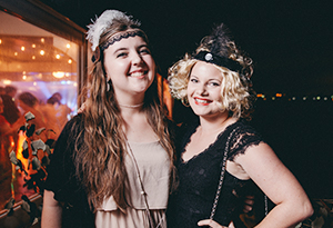 Two UniHallers dressed up in gatsby costumes on the rivercruise