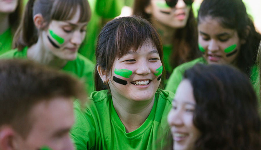 UniHallers in their green fresher shirts and face paint at the festival