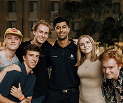 Image of six students posing and smiling to the camera
