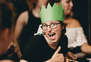 UniHaller wearing a party hat at an event