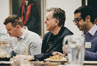 Professor Barry Marshall networking over dinner with residents