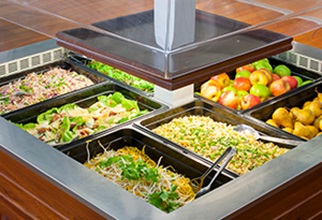 A variety of fresh ready made salads and fruit at the salad bar