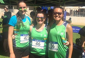 Three residents ready to run with their racing bibs