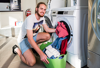 Male resident in shared laundry