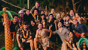 UniHallers dressed up in tiki themed outfits at the UniHall commencement event in 2017