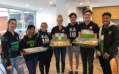 Image of team of residents with the baking they have made for families