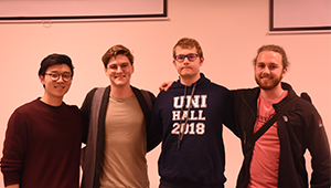 Four debating students together at the academic debate